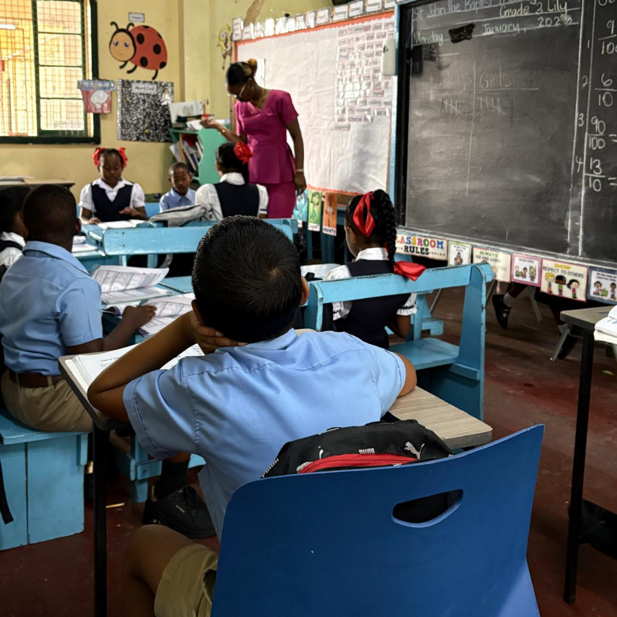 Teacher and students in a Guyanese classroom
